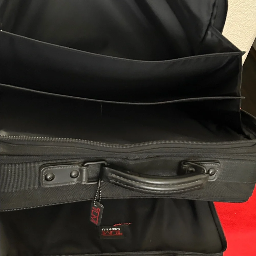 Tumi Black brief case/messenger bag